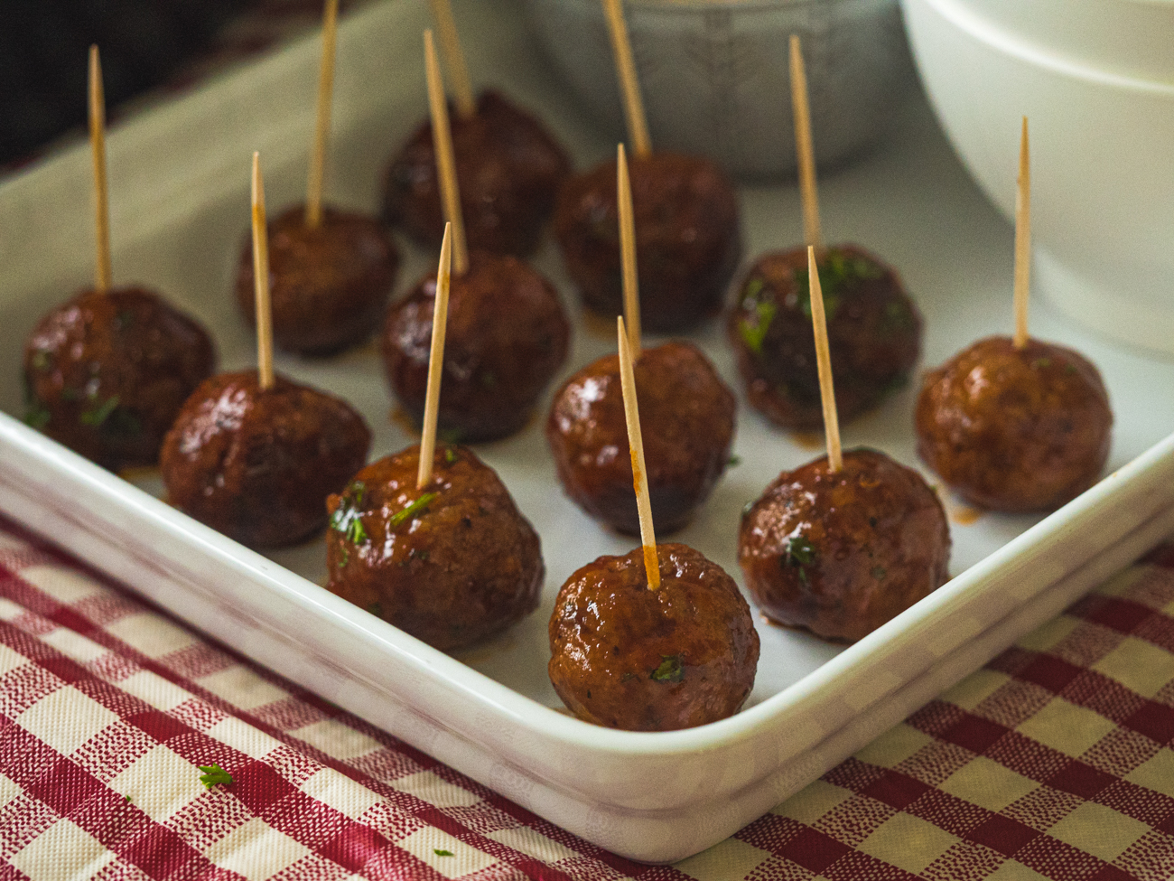 Slow Cooker Chipotle Meatballs on a tray with cocktail sticks
