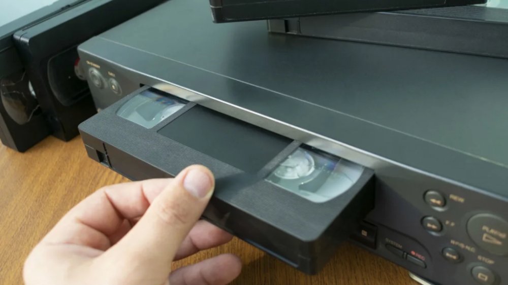 tape being inserted into a VCR player