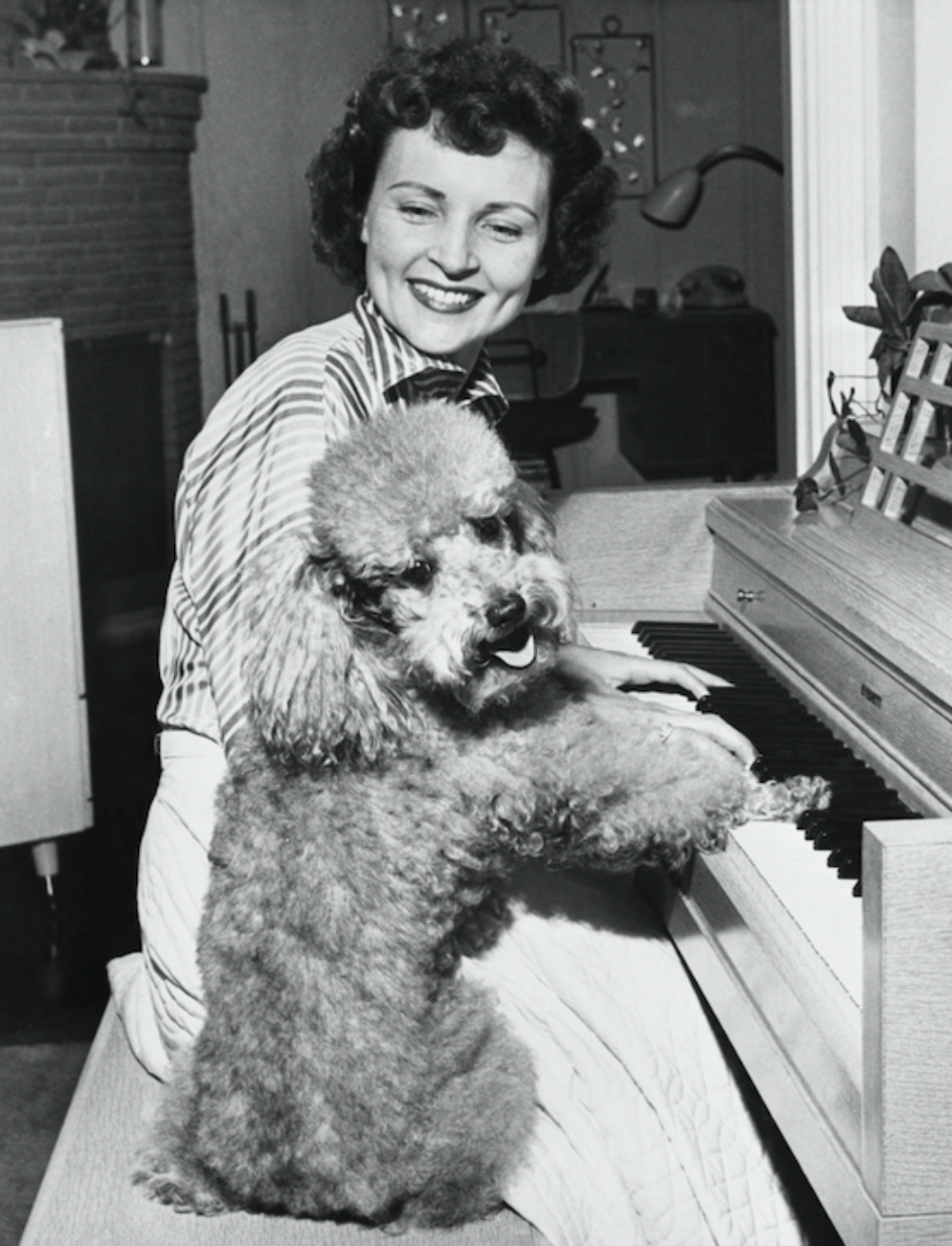 Betty White and her dog, Danny, at the piano