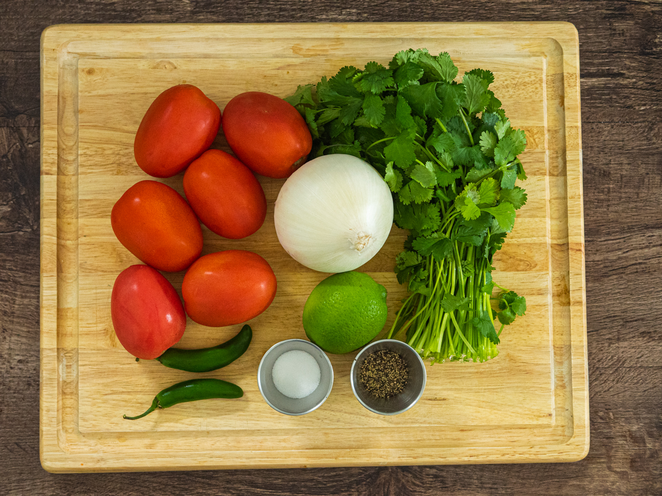 pico de gallo ingredients on a cutting board