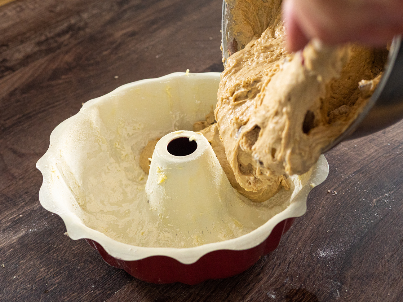 Election Cake batter being poured into bundt pan