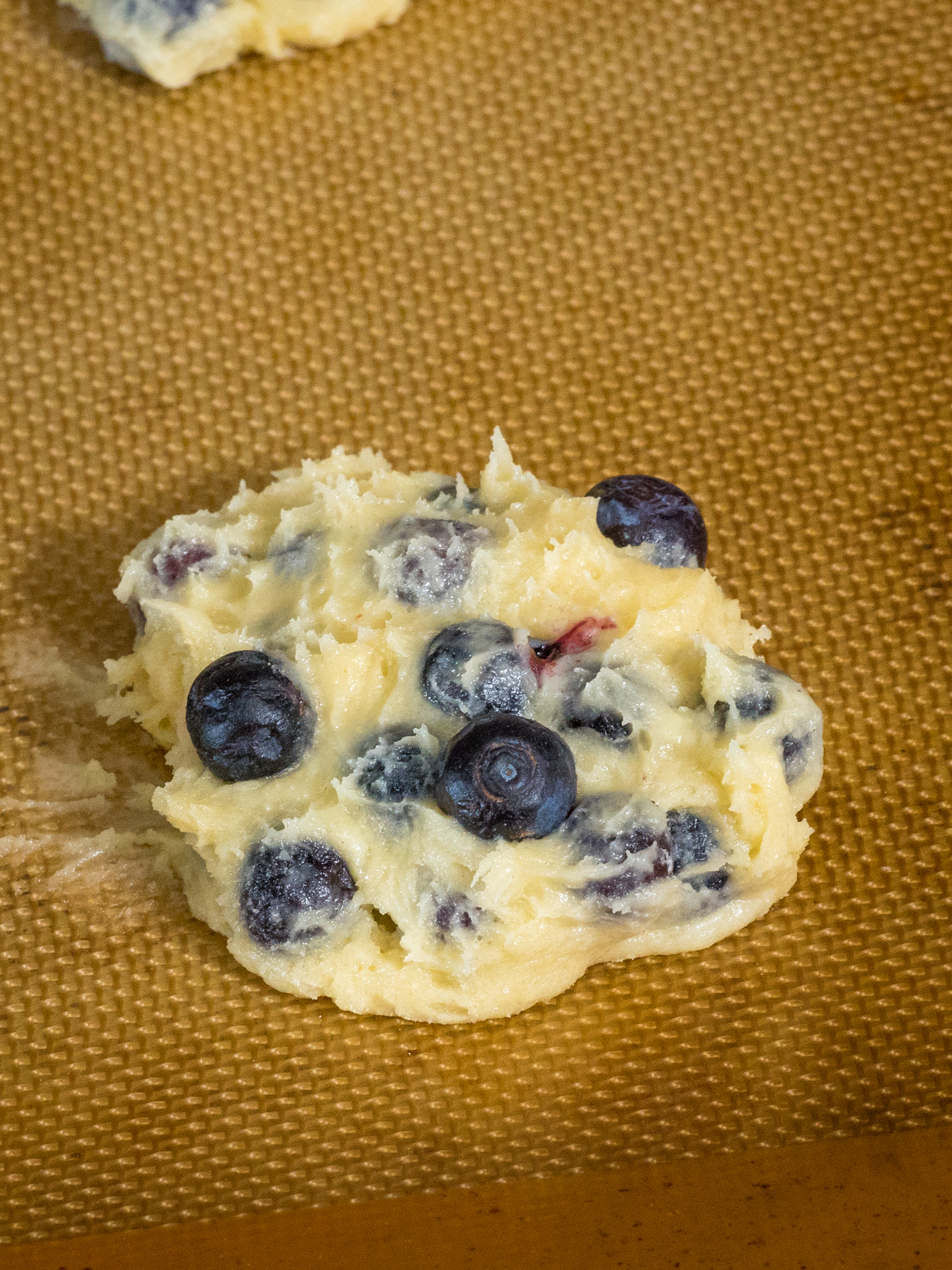 blueberry muffin tops on silpat liner