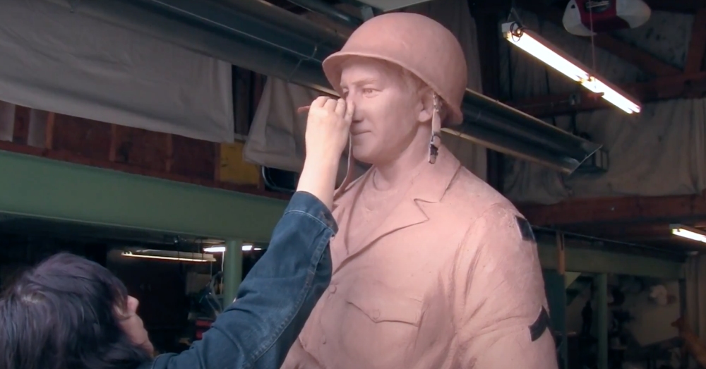 Adding fine details to the sculpture.