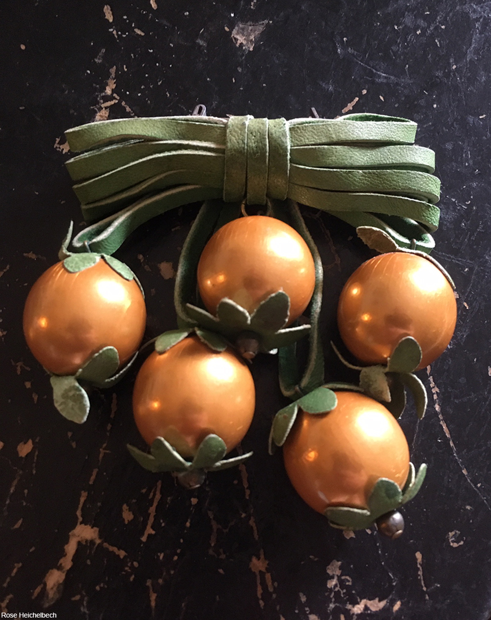 1930s or 1940s wood and leather brooch depicting oranges