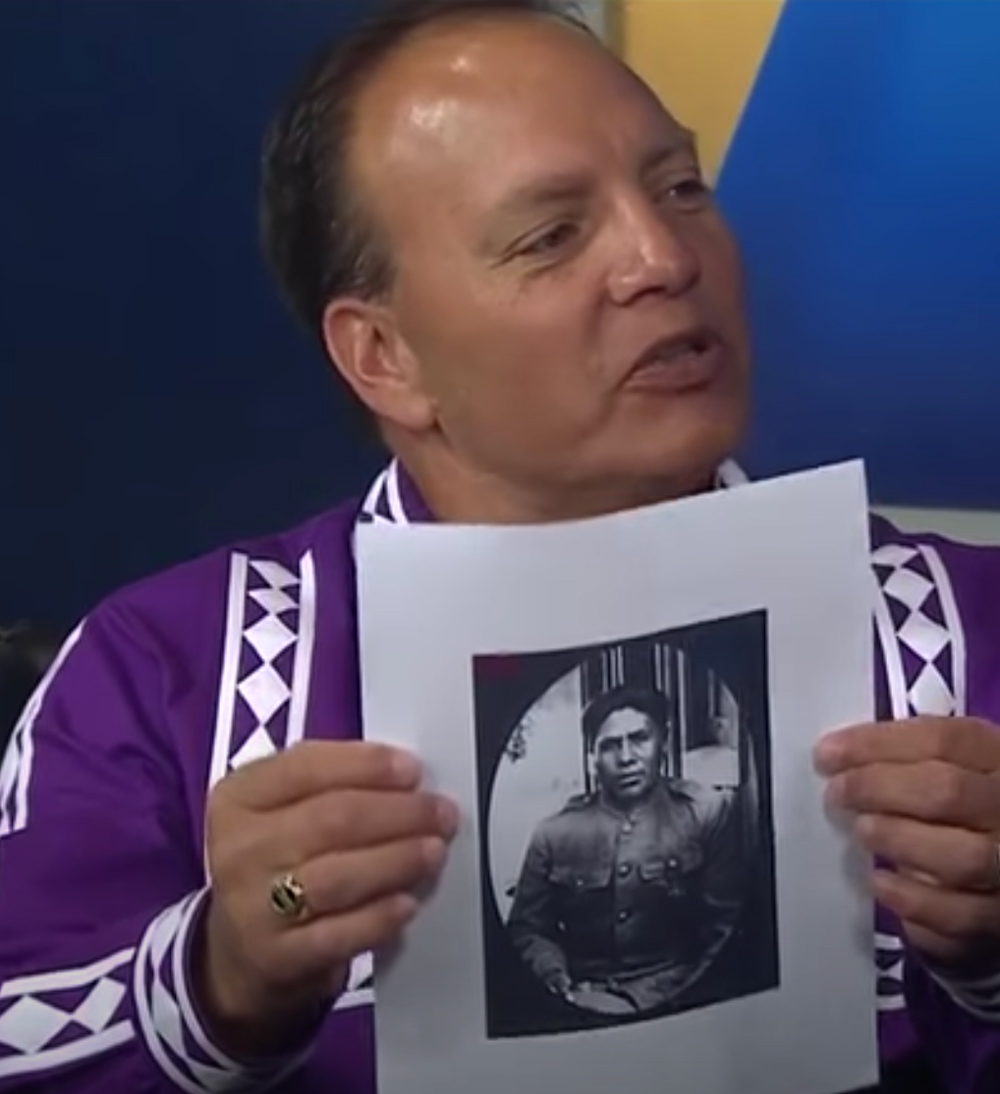 Chief Batton holds an image of Joseph Oklahombi.