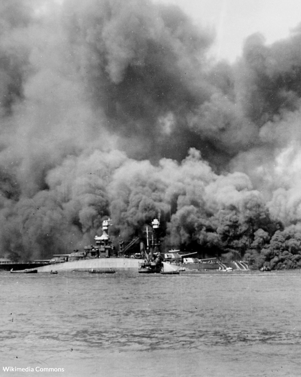 The USS Oklahoma on fire.