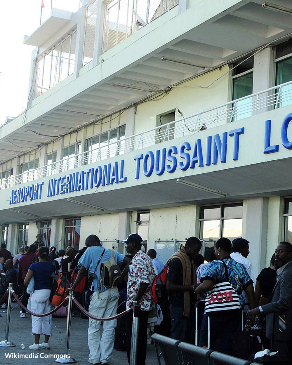 People waiting outside the crowded airport in Port au Prince.